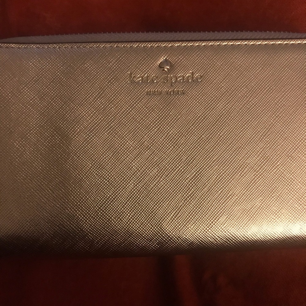 Metallic Gold Kate Spade Wristlet; good condition. - Picture 5 of 8